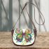 Colorful butterfly with floral designs on its wings saddle bag