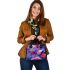 Colorful butterfly with flowers and leaves on purple shoulder handbag