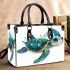 Cute baby turtle in the ocean small handbag