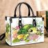 Cute baby turtle surrounded by bubbles small handbag