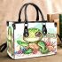 Cute baby turtle with big eyes sitting small handbag