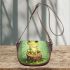 Cute cartoon frog sitting on a tree stump with big eyes saddle bag