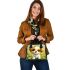 Cute cartoon puppy sitting on the grass shoulder handbag