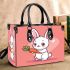 Cute cartoon rabbit playing with a carrot small handbag