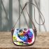 Cute colorful owl with big eyes sitting on a tree branch saddle bag
