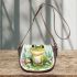 Cute frog sitting on the ground with flowers saddle bag