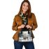 Cute little deer standing in the snow shoulder handbag