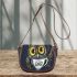 Cute owl with big yellow eyes holding a coffee cup saddle bag
