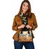 Elegant deer standing amidst autumn foliage shoulder handbag