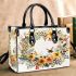 Floral wreath with bumblebee by tracie grimwood small handbag