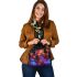 Frog is sitting on the ground in an enchanted forest shoulder handbag