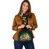 Frog jumping on a pink lotus flower shoulder handbag