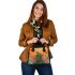 Green frog sitting on top of an island with smoke coming shoulder handbag