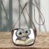 Grey owl with big eyes wearing glasses saddle bag