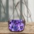 Purple crocuses and purple butterflies saddle bag