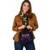 Purple frog with bright green eyes and on a solid shoulder handbag
