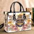 Queen bee sitting on top of honeycomb small handbag