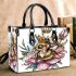 Queen bee with a crown sitting on flower small handbag