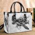 Sea turtle in black and white with a splash water effect small handbag