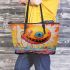 Smiling yellow sphere in whimsical environment leather tote bag