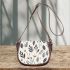 Tranquil Blossoms Minimalistic Floral Charm Saddle Bag