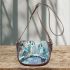 Two cute owls with feathers in shades of blue saddle bag