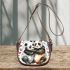 Two cute pandas hugging surrounded saddle bag