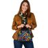 Vibrant and colorful painting of fish shoulder handbag