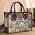 Vibrant pattern of pink and turquoise butterflies small handbag