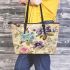 Vintage floral table arrangement leather tote bag