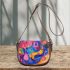 Watercolor painting with colorful patterns and shapes saddle bag