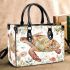 Whimsical watercolor turtle with floral patterns small handbag