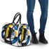 Abstract shapes in blue yellow and black forming 3d travel bag