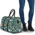 Butterflies and flowers scattered across 3d travel bag