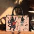 cat dances with the skeleton king with guitar trumpet Small handbag