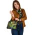 Colorful cartoon frogs hanging from tree branches in the jungle shoulder handbag