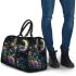Colorful glowing butterfly surrounded by flowers and leaves 3d travel bag