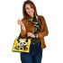 Cute baby panda with sunflowers on a yellow shoulder handbag