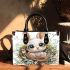 Cute cartoon baby bunny with big eyes sitting small handbag