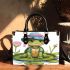 Cute cartoon turtle sitting on a lily pad small handbag