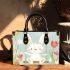 Cute white rabbit sitting on the swing small handbag