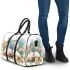 Dragonfly sitting on an open book surrounded by flowers 3d travel bag