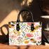 Featuring pastel flowers and bees small handbag