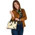 Featuring various butterflies in flight shoulder handbag