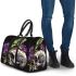 Green frog sitting on top of an skull with purple thistles growing 3d travel bag