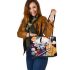 Musical spheres and flowing hair leather tote bag