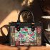 Vibrant pattern of pink and turquoise butterflies small handbag