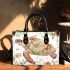 Whimsical watercolor turtle with floral patterns small handbag