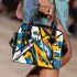 Abstract blue and yellow geometric masterpiece shoulder handbag