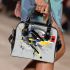 Abstract composition featuring various geometric shapes shoulder handbag